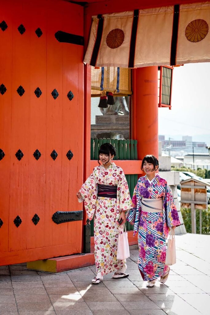 Two girls dressed in a yukuta at Fushimi Inari-taisha in Kyoto. Read more about My 8 Favorite Things to Do and See in Kyoto on Urban Pixxels.