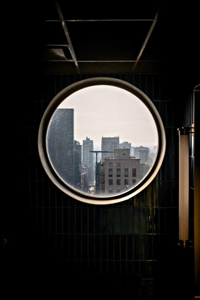 View of Chicago through the window at the Apogee rooftop bar at the Dana Hotel and Spa 