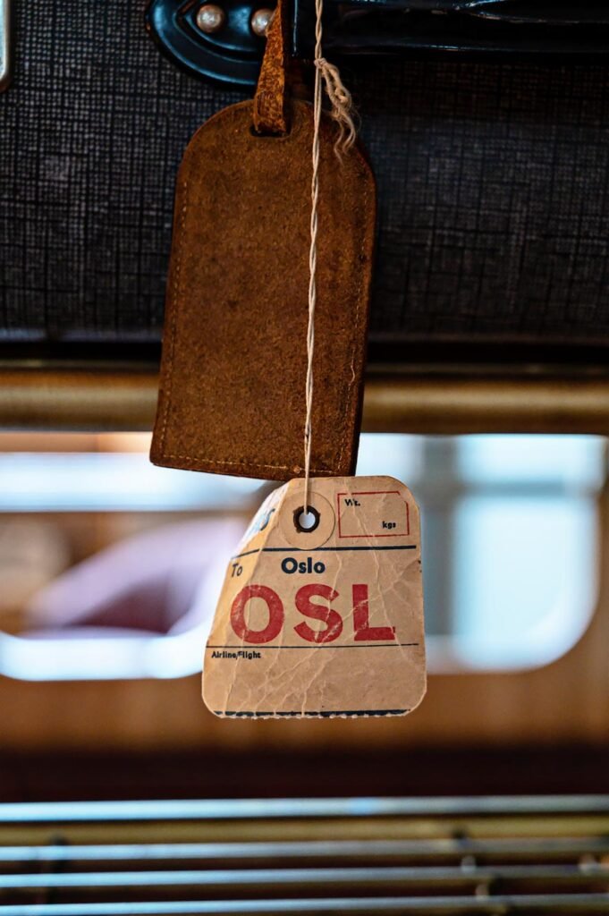 Vintage luggage tag in the Heritage Room at Amerikalinjen, Oslo's most beautiful boutique hotel.