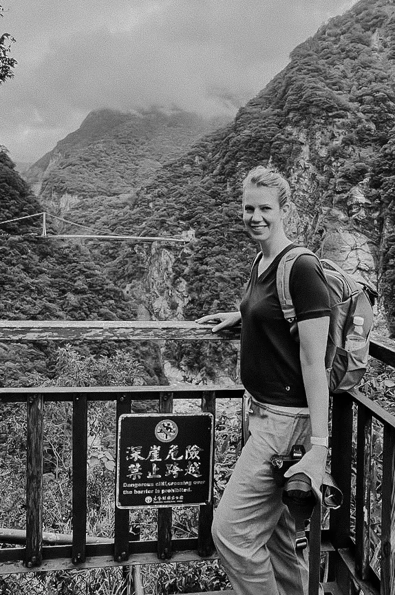 Jacintha at warning sign at Taroko Gorge national park.