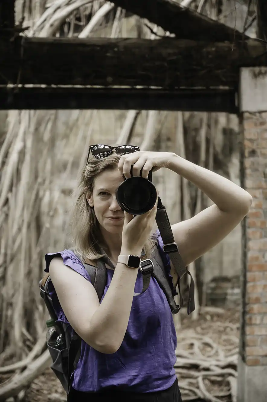 Jacintha taking photo in a mirror at Anping Tree House in Tainan