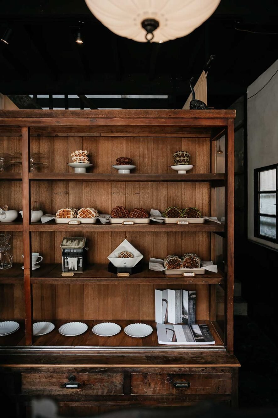 Wooden cabinet with liege waffles at Moku Sho, one of the best coffee shops in Chiayi, Taiwan