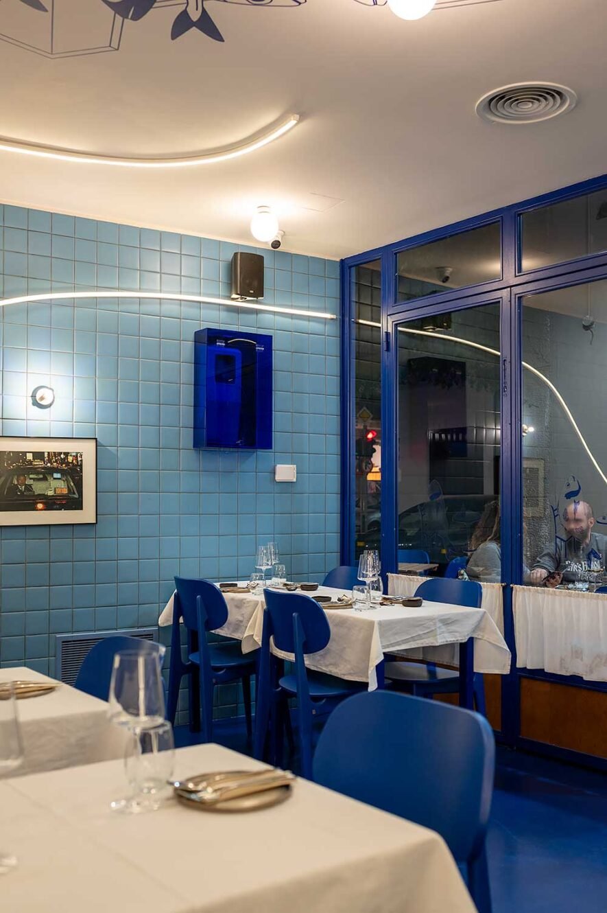 Modern seafood restaurant Manu in Athens with blue and white interior