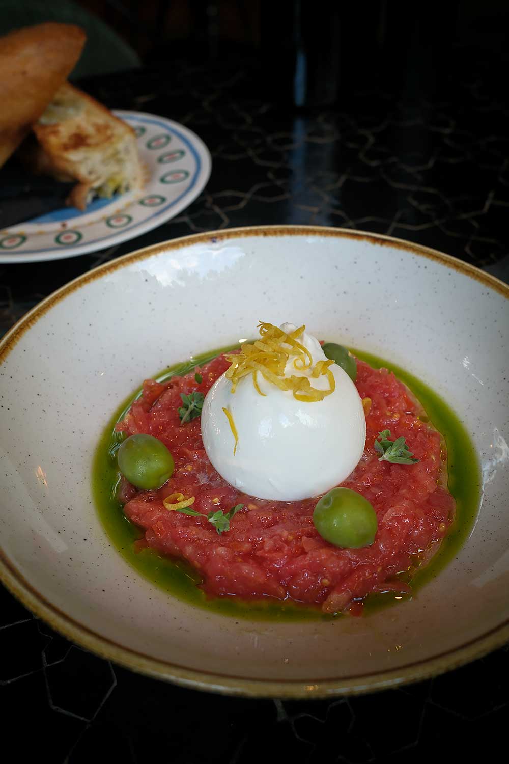 Tomato and burrata at Restaurant Pop's Aperitivo for a casual dinner with pizza and pasta in Ljubljana
