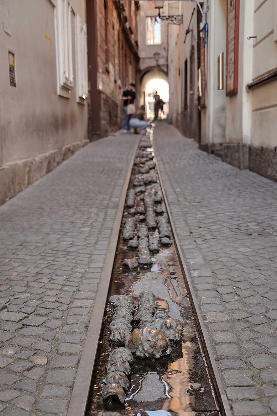 bronze installation Faces by Slovenian artist Jakov Brdar in Ljubljana